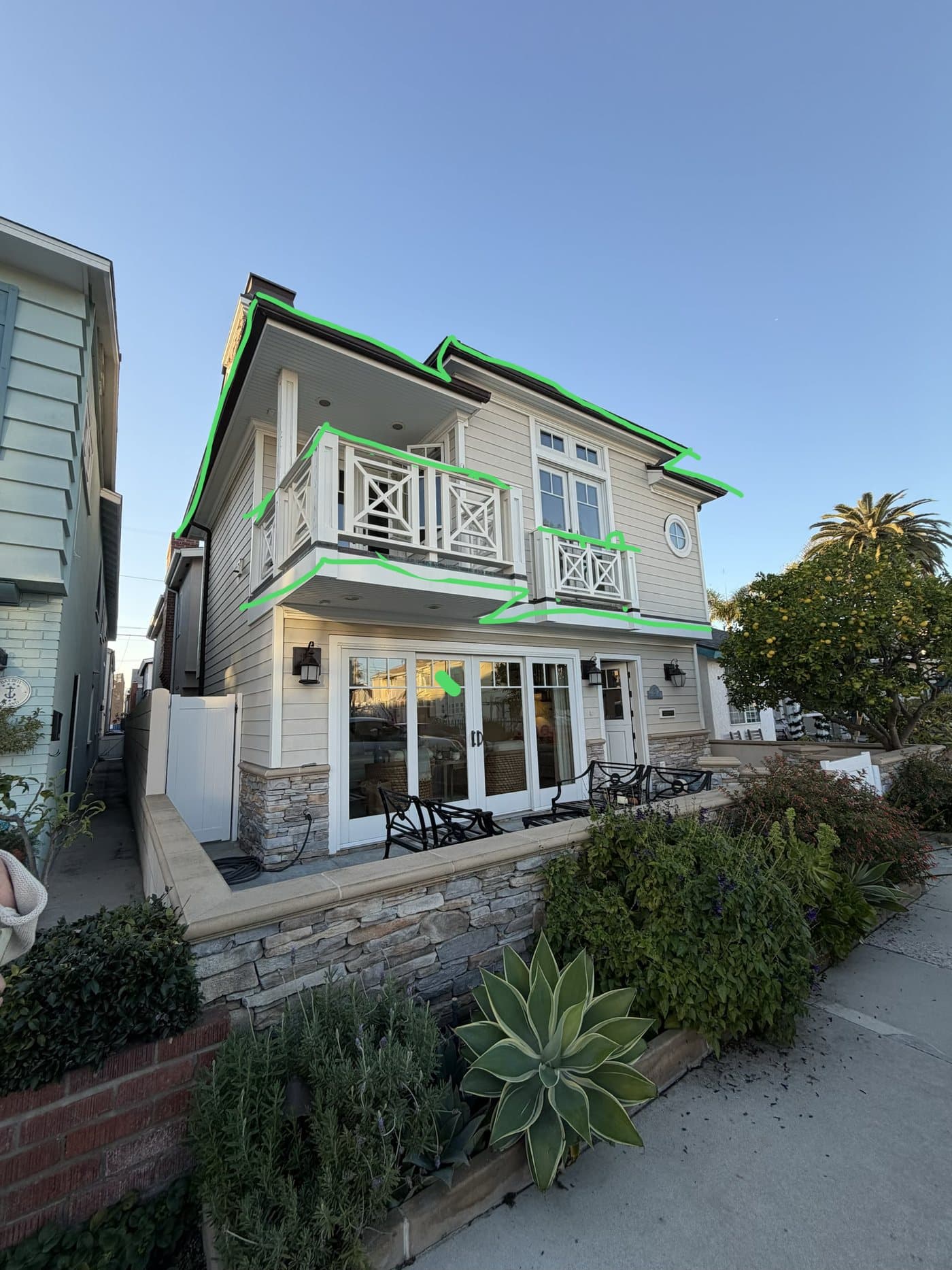 Design markup on a coastal home's gables and balcony