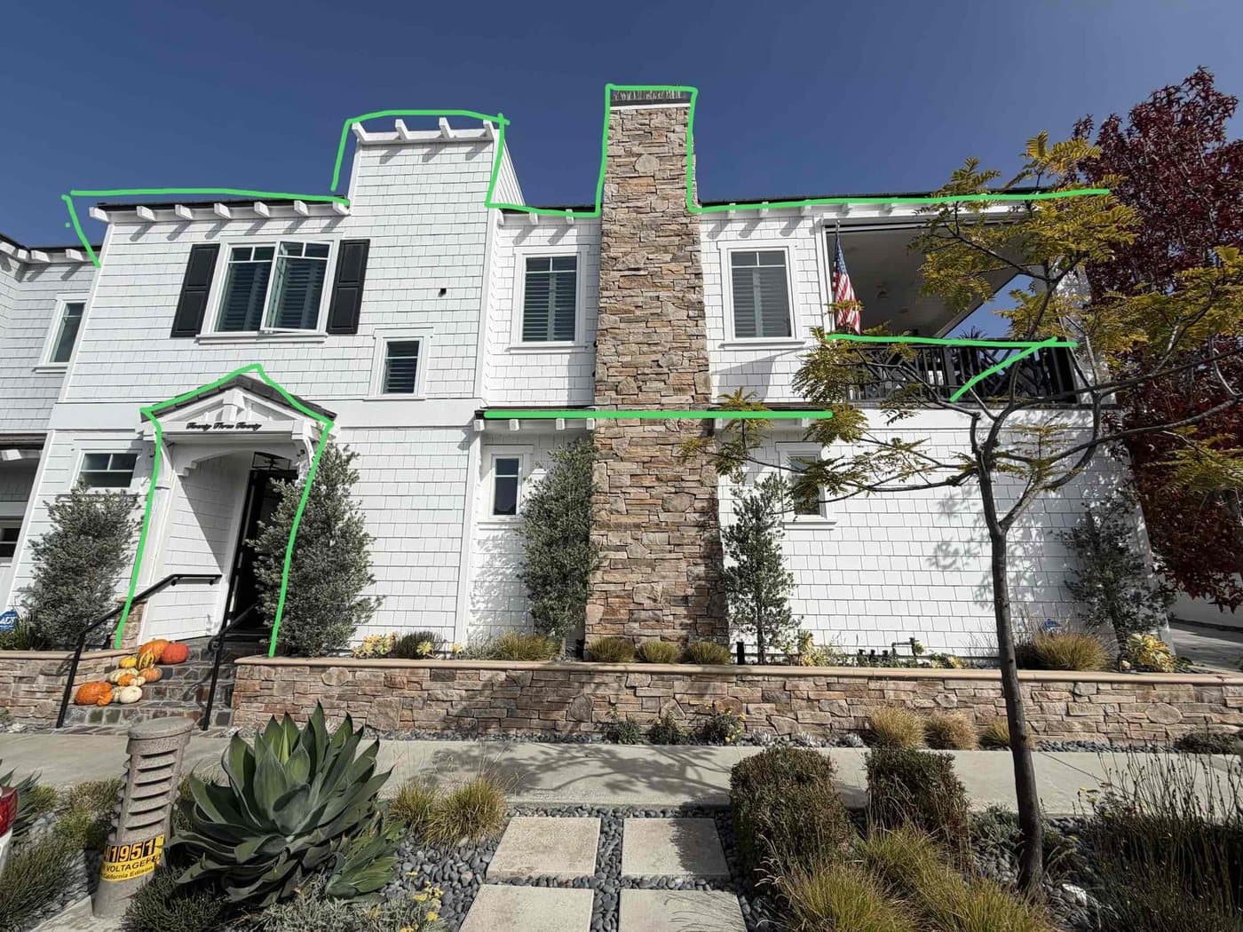 Design markup tracing rooflines and gables on a two-story home